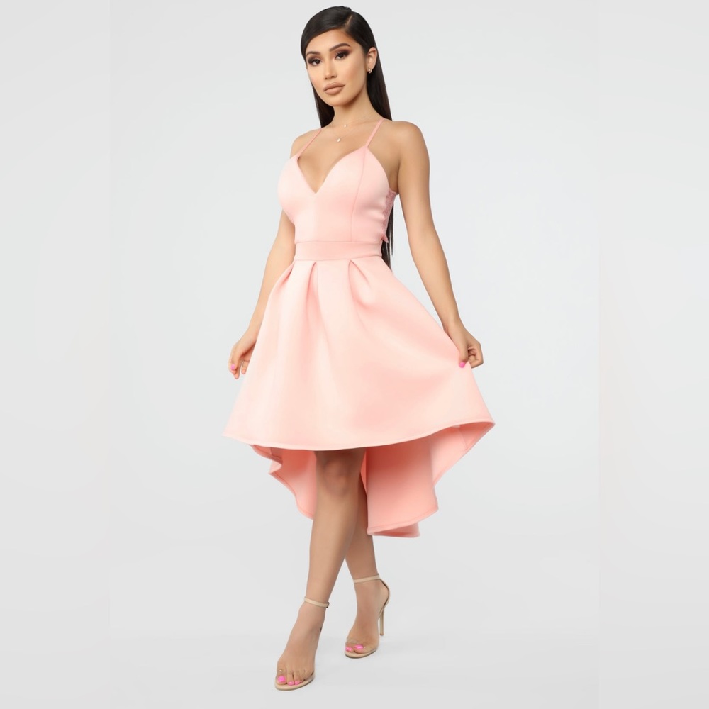 This is a high and low dress with a pretty lace bow back.
